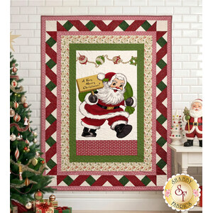 link to Ribbon Border Panel Quilt Kit - Santa's Coming to Town