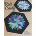 Two hexagonal quilted table toppers in pastel colors, titled Rock Candy, on a light wooden background.