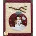 Block 12 of the Winter Wonderland Wool quilt featuring an ornament with a snowman on it