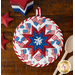 Patriotic hot pad made with America the Beautiful fabrics on a wood table