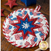 The center star design of the America the Beautiful Folded Star Hot Pad