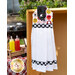 White hanging towel hung outside in front of a picnic table and bbq