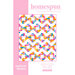 Cover of a quilt pattern titled Homespun by Morgan McLaughlin. The design features a colorful geometric pattern with various shapes in pink, yellow, blue, and white. The cover also includes text indicating different sizes for the quilt: baby/child throw, small throw, and large throw, along with the phrase Sew Friendly. The brand name modernly morgan is displayed at the bottom.