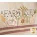 An embroidered design featuring the words FARM GIRL with illustrations of vegetables like corn, tomatoes, peas, and carrots, along with a sunflower, on a textured fabric background.