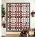 A beautiful red, white, and blue patriotic quilt hung from a wall