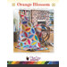 front cover of Orange Blossom Quilt pattern with a sample quilt draped over a rocking chair