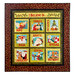 A quilt with nine squares, each featuring a festive design and a word related to holiday themes. The top row includes Hope, Family, and Peace; the middle row includes Hugs, Santa, and Dreams; the bottom row includes Laughter, Giving, and Harmony. The border is decorated with a holly pattern.