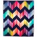 The Ridiculously Easy Jelly Roll Quilt in colorful colors on a black background