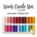 Image shows a collection of colorful spools of thread arranged in a row, labeled Wooly Candle Mat Club Appliqué Thread Set at the top. The spools vary in shades, including whites, pinks, purples, blues, oranges, and browns.