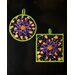 Round and Square hot pads with central folded star design featuring Halloween themed fabrics.