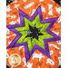 Round hot pad with central folded star design featuring Halloween themed fabrics.