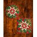 Two green hot pads with central folded star featuring cardinals and holly.