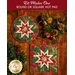 Two green hot pads with central folded star featuring cardinals and holly.