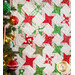 Christmas quilt featuring green and red stars on white background.