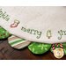 White Scalloped Table Topper with red and green scallops featuring Christmas themed embroidery of the word 