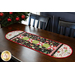 Christmas themed table runner featuring phrases, ornaments, and snowflakes, designed with rounded sides and central pinwheels.