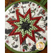 Round hot pad made with white fabric featuring farm animals wearing winter holiday clothes.