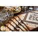 Coffee themed placemats made of brown, tan, and cream fabrics with coffee cups in the center surrounded by strips of fabric in a diamond shape.