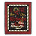 A quilted wall hanging featuring the text HOME for the Holidays in bold letters, with a festive wreath and a red truck carrying presents and a Christmas tree, set against a black background and framed with a green and red geometric border.