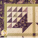 Wall hanging made with Geometric designs in purple and cream floral fabrics.