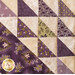 Wall hanging made with Geometric designs in purple and cream floral fabrics.