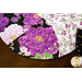 Braided twist made of black and white fabrics featuring purple florals and butterflies.
