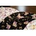 Braided twist made of black and white fabrics featuring purple florals and butterflies.