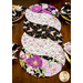 Braided twist being used as table runner on table set with plates and cloth napkins.