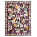 Quilt with patchwork design made of purple, yellow, teal, and black fabrics featuring florals, fish, and butterflies.