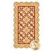 A quilt design featuring a floral and geometric pattern in warm tones of yellow and red, bordered with a scalloped edge. The central motif includes various star and block shapes, with a repeating floral element throughout.