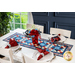 Red, white, and blue table runner made of patriotic fabric prints and geometric piecing.