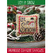The front of the Let it Snow Cross Stitch pattern by Primrose Cottage showing the finished project.