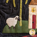 A quilted patchwork depicting a sheep standing on green grass near a small house with a red door and yellow windows, surrounded by a tree. The background features dark fabric with wavy patterns.