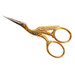 Beautiful gold and silver embroidery scissors that look like a stork
