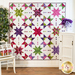 A quilt with geometric square and triangle designs made of multicolor fabrics on white.