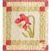 Quilted wall hanging featuring a red and yellow flower design with a decorative patterned border.