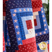 Americana themed quilt blocks with red, white, and blue star-filled fabrics.