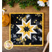 Square Hot pad with central folded star design made of black bee themed fabrics with black and yellow accents.