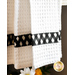 Towel with white waffle texture with black gingham band.