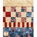 A patchwork quilt featuring red, white, and blue patterns with stars and stripes, showcasing patriotic themes.