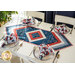 Table runner with central diamond design and angled strips at the ends made of patriotic printed fabrics.