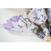 Two sided cloth napkins one side with purple fabric the other with white fabric featuring lavender prints.