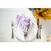Two sided cloth napkin one side with purple fabric the other with white fabric featuring lavender prints.