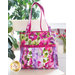 Tote bag made of strips of bright colorful floral printed fabrics in a watercolor style.