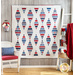 White quilt with diamonds made of strips of red white and blue patriotic fabrics.