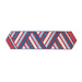 Table runner made of strips of alternating diagonal fabrics in red, white, and blue featuring patriotic motifs.