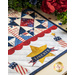 Pint Size Table Runner featuring geometric stars in red, white, and blue, along with star and firework appliqué at each end.