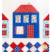 Row of houses made of red white and blue fabric on white quilt.