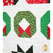 Quilt featuring rows of Christmas themed motifs on white background.