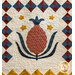 Colorful quilt featuring a central pineapple design with blue leaves and yellow stars on a cream background.